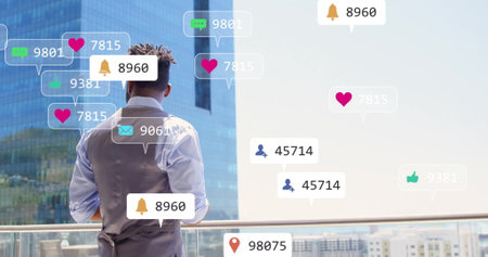 Standing on balcony, man with image of social media notifications over cityscape. Technology,...