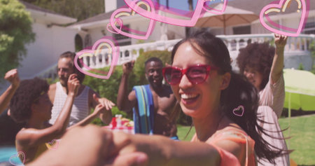Dancing woman in red sunglasses leading friends around backyard pool, with heart overlay and towel....