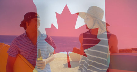 Friends wearing striped tops and hats chatting on beach by ocean, with surfboards, beer bottle....