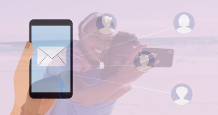 Connecting smartphone with envelope icon to couple using phone on beach via profiles, copy space....