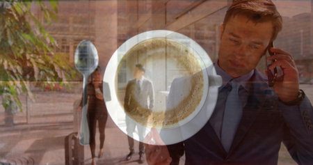 Sitting white ceramic cup of coffee on saucer in urban plaza, with rolling suitcase and smartphone. Minimalist, professional, urban, modern, lifestyle, business, travelの写真素材