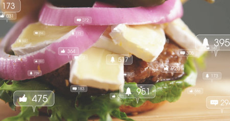 Showing beef burger layering lettuce cheese pickled onion rings on board with social reaction icons. Gourmet, burger, culinary, food, fastfood, stacked, snackの写真素材