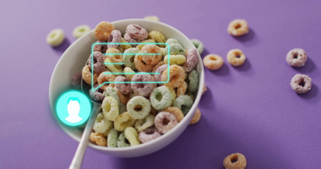 White bowl holding rings, sitting on purple tabletop, with silver spoon and turquoise UI overlay. Cereal, breakfast, modern, vibrant, minimalism, food photography, digital interfaceの写真素材
