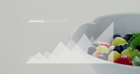 Showing bowl with grapes, blueberries, strawberries and mint on table with grid overlay, copy space....