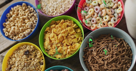 Displaying eight colorful cereal bowls lining wooden table, showcasing various cereal types....