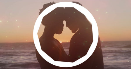 Pressing foreheads couple standing on beach at sunset, with white octagonal frame, water horizon. Romance, connection, serenity, harmony, dusk, intimacy, tranquilityの写真素材