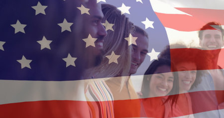 Smiling group of friends standing on plain background, with semi-transparent American flag overlay....