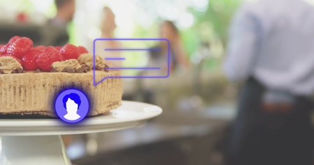 Showing layered cake topped with raspberries sitting on stand at cafe with overlay, copy space. Dessert, gathering, social, elegance, floral, ambiance, celebrationの写真素材