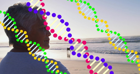 Senior woman standing on beach at sunset, with small dog walking and DNA overlay, copy space. Serenity, relaxation, friendship, wellness, leisure, vitality, abstractの写真素材