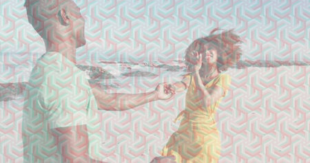 Kneeling man offering small jewelry box to woman in yellow sundress on sandy beach, proposal. Romance, engagement, outdoor, natural, joyful, affectionate, minimalistの写真素材