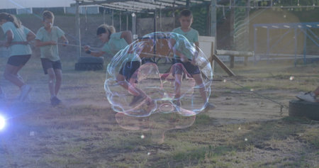 Six children in sportswear pulling rope during tug-of-war on field, with holographic brain model. Teamwork, childhood, outdoor activity, playground, collaboration, physical exercise, educationの写真素材