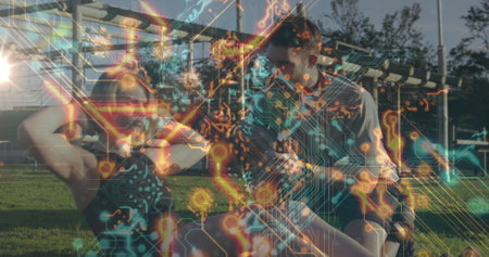 Performing sit-ups woman being assisted by man on grassy area with bars circuit-board overlay. Outdoor fitness, strength training, augmented reality, athletic environment, healthy lifestyle, digital overlay, sports scienceの写真素材