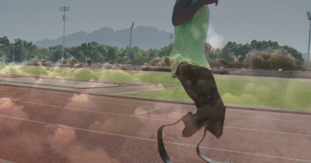 Running teenage athlete wearing sportswear on red track, with carbon-fiber blades, copy space....