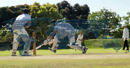 Diving batsman sliding into crease on cricket pitch, with ball stumps and digital world map overlay. Athletic, competition, sport, urban, dynamic, technology, teamworkの写真素材