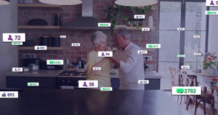 Dancing seniors wearing checked shirt and sweater in home kitchen with dark island, floating icons....
