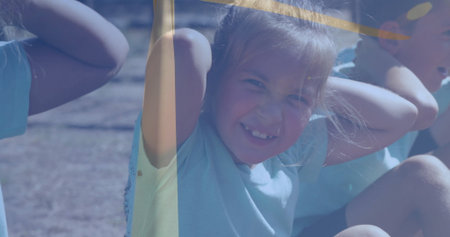 Doing sit-ups children in light blue t-shirts, dark shorts lying on sports field dirt, core workout....