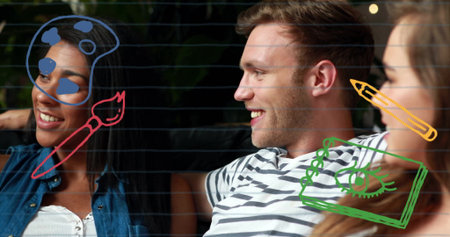 Smiling man reclining on couch in lounge area, with digital doodles of palette, brush and pencil. Collaboration, creativity, relaxation, artistic, modern, homely, vibrantの写真素材