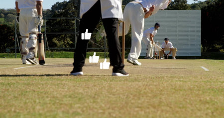 Delivering bowler in whites releasing cricket ball at cricket ground, with sight screen, copy space....