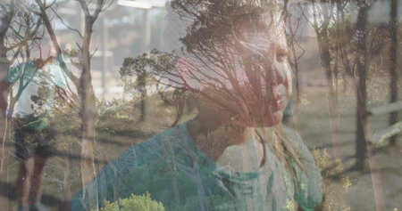 Blending longhaired girl's face with bare tree reflections on glass pane in room, with metal bars. Double exposure, portrait, nature, reflection, serenity, minimalism, interiorの写真素材