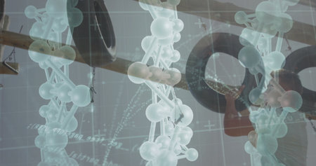 Floating translucent molecular models overlaying gym rig, showing gridlines and man gripping tire. Science, fitness, technology, kinetic, biomechanical, innovation, strengthの写真素材