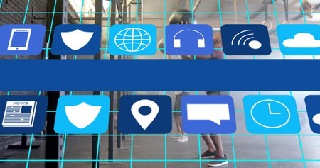 Team in athletic clothing lifting barbells and swinging kettlebells on gym rig with app icon grid. Fitness, strength, teamwork, gym, training, modern, activeの写真素材