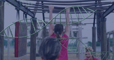 Hanging woman in fuchsia sportswear traversing obstacle course in park, with wooden monkey bars....