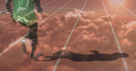 Sprinting athlete wearing green singlet and shorts on red track, with carbon fiber prosthetic blade....