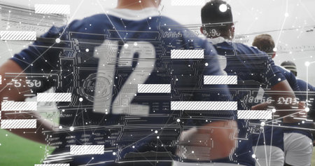 Standing six male athletes wearing navy jerseys and white shorts on grass turf with digital overlay. Athletics, teamwork, fitness, digital, analytics, sport, strengthの写真素材