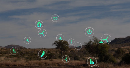 Floating green energy icons hovering above dry grassland plain, with wind turbine plug CO2 icons....