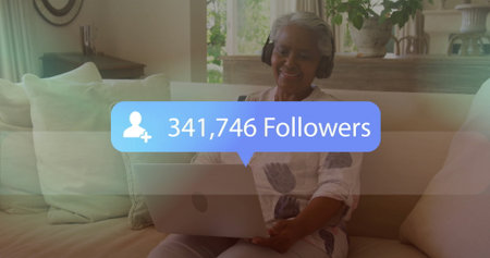 Smiling woman with headphones browsing laptop on sofa at home, overlay reading 341,746 followers....