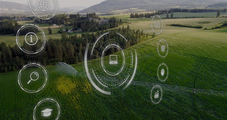 Displaying interface with laptop icon hovering over farmland, with irrigation sprinklers. Precision agriculture, digital farming, sustainable, drone, eco-friendly, modern, technologyの写真素材
