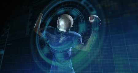 Helmeted player in blue jersey holding football, raising arm in lab, with holographic data rings. Athlete, sports, technology, digital, innovation, performance, futuristicの写真素材