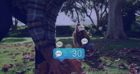 Collecting fallen leaves, man in plaid shirt bending in park with chat bubble 30, copy space....