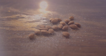 Shimmering raw almonds resting on polished wooden tabletop, with sugar-like granules. Nutritious, gourmet, rustic, natural, elegant, minimalistic, healthの写真素材