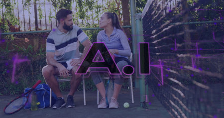 Sitting couple wearing athletic attire gripping towel, racket and ball on tennis court metal bench. Sports, leisure, outdoor, activewear, fitness, teamwork, relaxationの写真素材