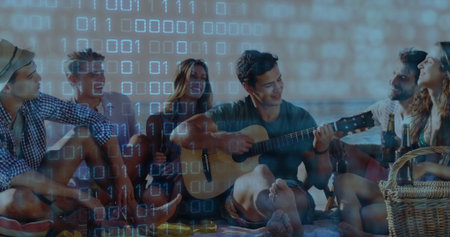 Group of friends playing acoustic guitar and sipping beer on beach at sunset, with picnic basket. Carefree, camaraderie, relaxation, outdoor, warm, social, leisureの写真素材