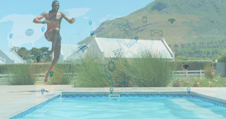 Leaping man wearing swim trunks over pool deck in backyard, with tall grasses and digital icons. Outdoor, leisure, modern, lifestyle, vibrant, activity, relaxationの写真素材