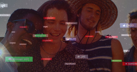 Laughing group of five friends tilting heads together outdoors under sky, with social media icons....