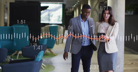 Walking colleagues holding smartphone and tablet in office lounge with teal armchairs data overlays....