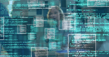 Gesturing woman wearing striped shirt interacting with code panels in dimly lit meeting room....