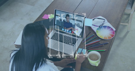 Joining woman on home-office call, with laptop color wheel pencils notebook, copy space....
