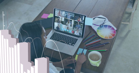 African American woman joining online meeting in home office, with laptop, color wheel, copy space....