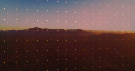 Displaying remote desert plateau silhouette at dusk, with translucent glowing square grid overlay....