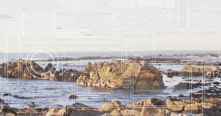 Revealing jagged rock clusters rising from ocean at low tide, with digital overlay panels and grids....