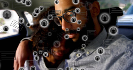 Leaning couple wearing glasses cuddling on car back seat, with floating chat icons. Romantic, connection, intimacy, technology, communication, lifestyle, modernの写真素材