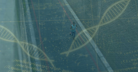 Jogger wearing blue top and hydration belt running along urban road, with glass panels, DNA overlay. Fitness, endurance, technology, health, urban, active, motionの写真素材