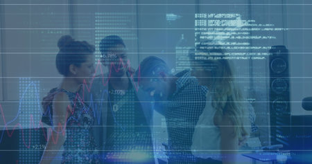 Collaborating professionals reviewing digital charts and code overlay at office desk, with monitors. Data, teamwork, innovation, analytics, technology, business, collaborationの写真素材