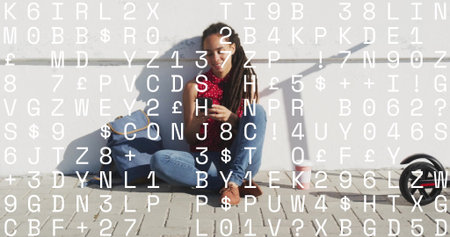Sitting woman in red top using smartphone on sidewalk, with tote bag, travel mug and scooter. Urban, casual, vibrant, lifestyle, contemporary, outdoor, relaxedの写真素材