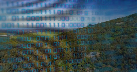 Displaying binary code overlay blending grassy plains, rolling hillside showing glowing blue digits. Nature, landscape, digital, technology, outdoor, serenity, innovationの写真素材