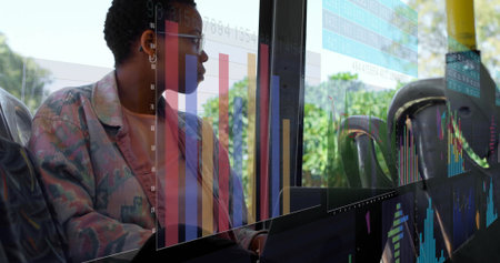 Analyzing woman in print jacket glasses reviewing laptop at bus window with AR overlay, copy space....